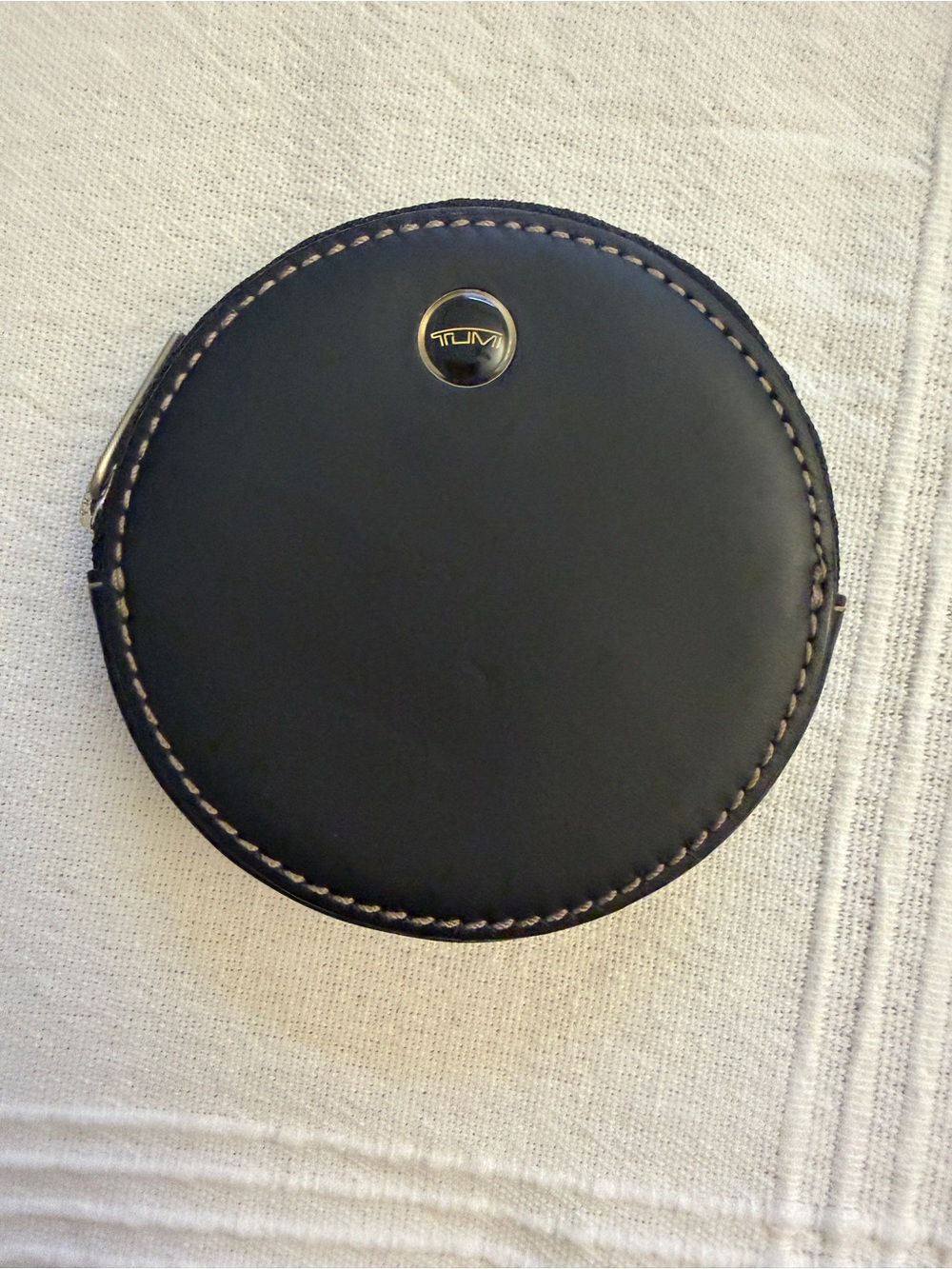 Tumi Black Round Leather Case with Contrast Stitching